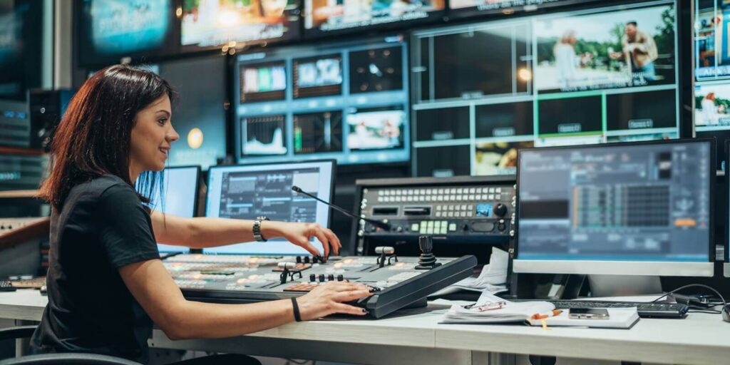 beautiful woman working in a broadcast control room on a tv station