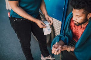 Man holding his Injured Hand On-Set