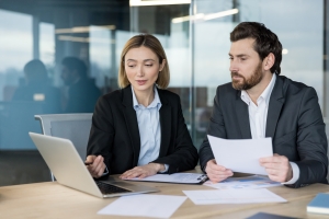 Reality TV Show Producer Discussing Insurance Policy with Agent