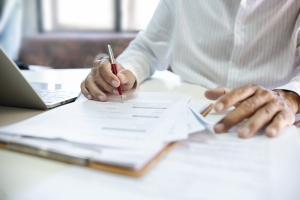 Producer Reviewing Film Production Insurance Policy Documents